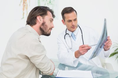 Doctor explaining a health report to a patient