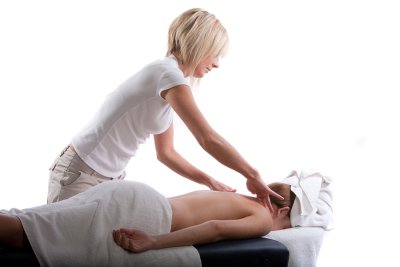 Massage therapist massaging a girl