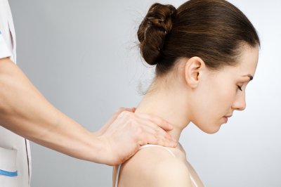 Massage therapist massaging a girl